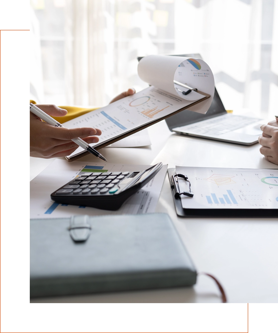 Business meeting with documents and calculator.