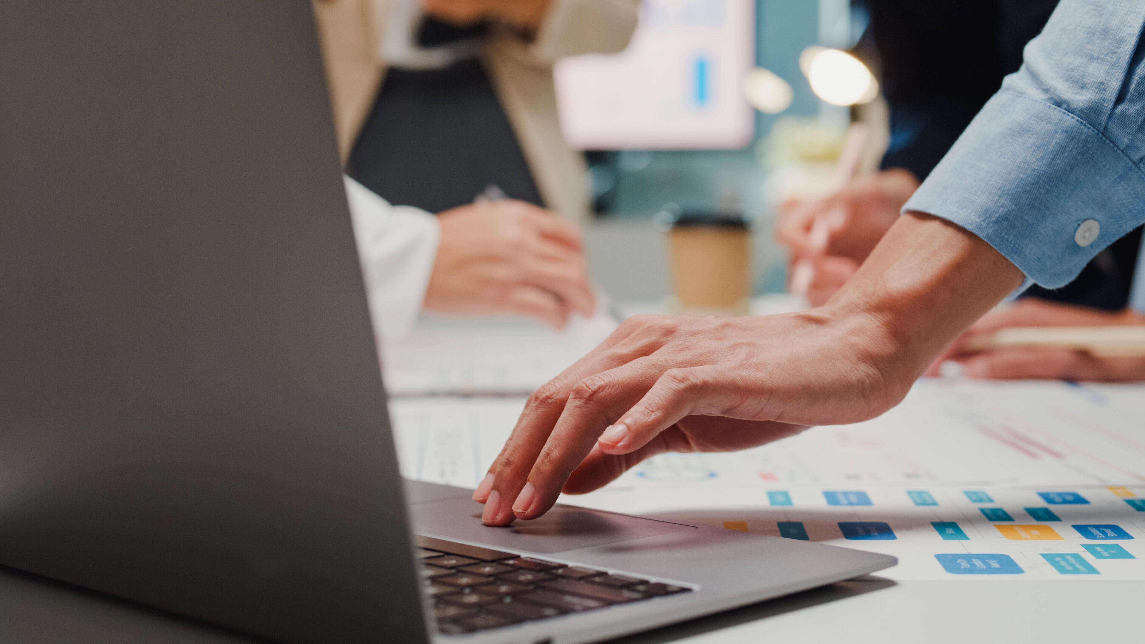 Closeup happy young Asia businesspeople meeting brainstorming some new ideas about project to his partner working together planning success strategy enjoy teamwork in small modern home office.